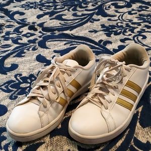 Adidas, white and gold sneakers.